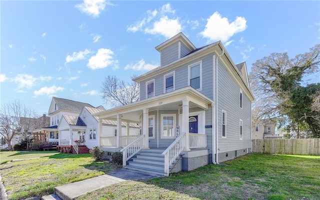 traditional style home with a porch, a front yard, and fence