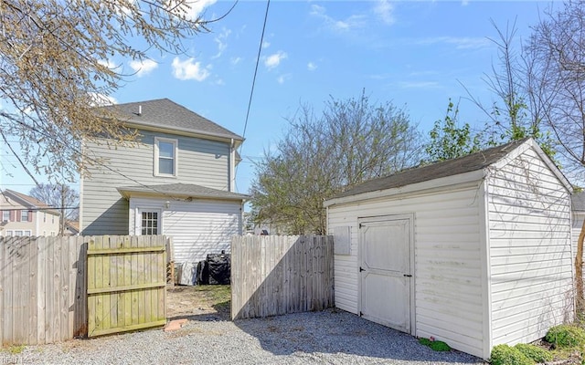 view of shed featuring fence