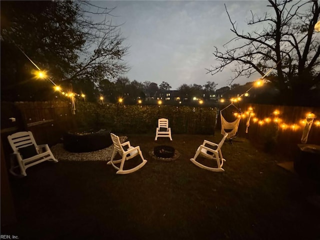 view of patio / terrace with fence and an outdoor fire pit