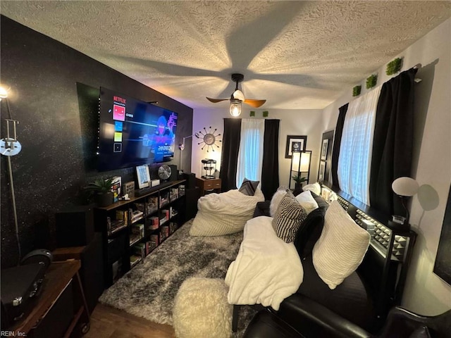 bedroom with a textured ceiling and ceiling fan