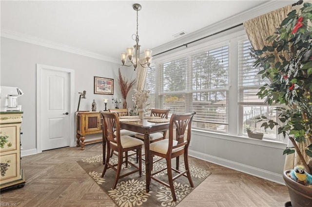 dining area featuring crown molding, baseboards, visible vents, and a chandelier