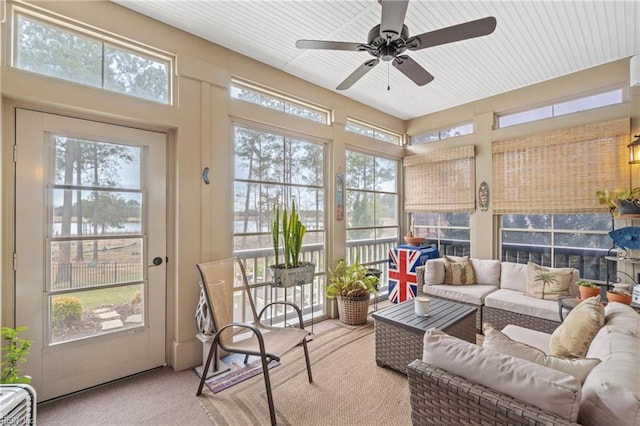 sunroom with a wealth of natural light and a ceiling fan