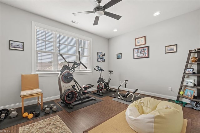 workout area with wood finished floors, visible vents, baseboards, recessed lighting, and ceiling fan