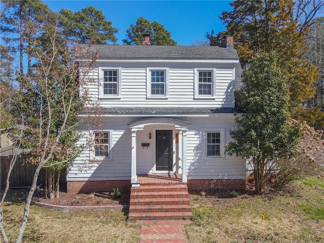 view of front of house with fence