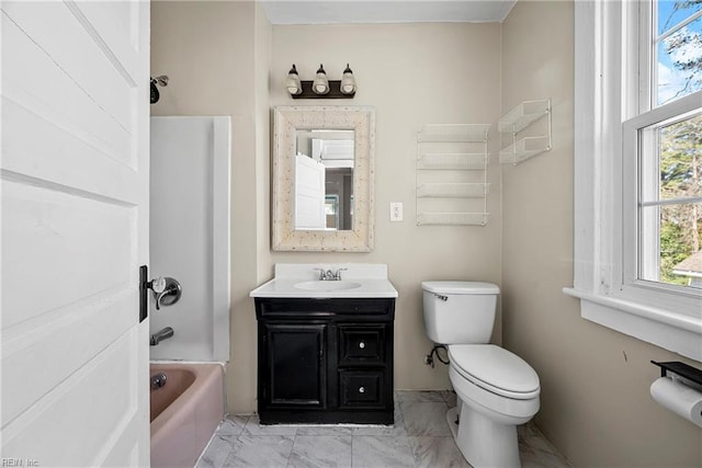 bathroom featuring vanity, toilet, bathtub / shower combination, and marble finish floor