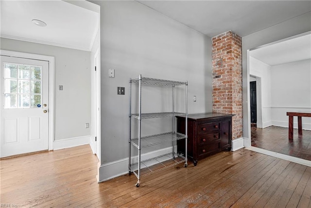 interior space with baseboards and hardwood / wood-style floors