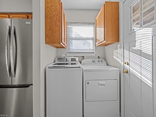 laundry area featuring washing machine and dryer and laundry area