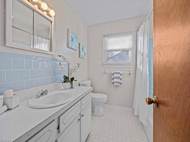 full bath with vanity, a shower with curtain, baseboards, tile patterned floors, and toilet