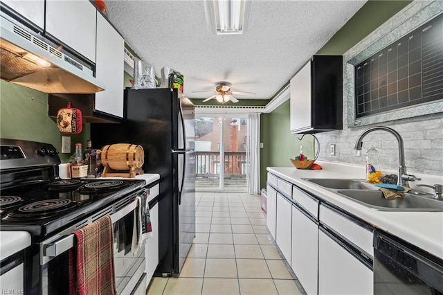 kitchen featuring electric range, under cabinet range hood, a sink, light tile patterned floors, and dishwasher