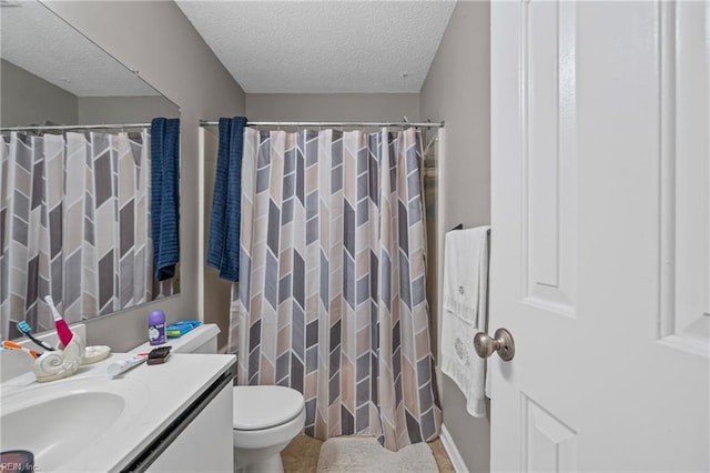 bathroom featuring curtained shower, a textured ceiling, vanity, and toilet