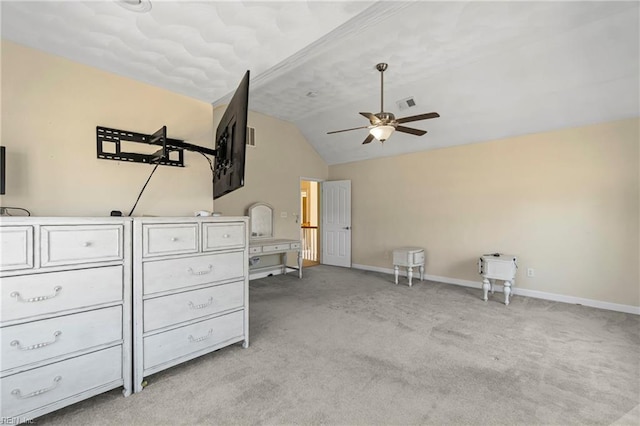 unfurnished bedroom featuring visible vents, lofted ceiling, light colored carpet, and baseboards