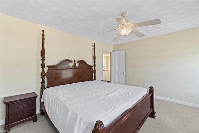 bedroom featuring ceiling fan, baseboards, and carpet floors