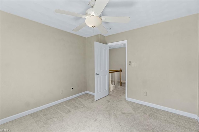 unfurnished bedroom with baseboards, carpet floors, and a ceiling fan