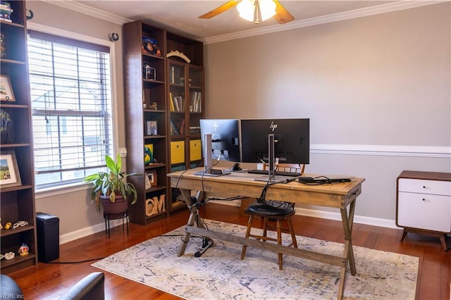 office space with a ceiling fan, crown molding, wood finished floors, and baseboards