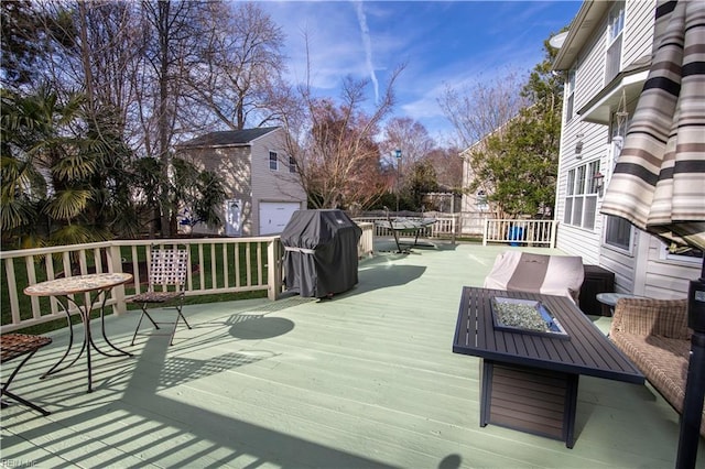 deck with grilling area and fence