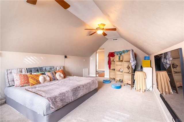 bedroom featuring lofted ceiling, carpet, visible vents, and ceiling fan