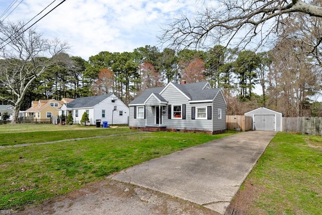 bungalow with a front yard, an outbuilding, fence, a garage, and crawl space