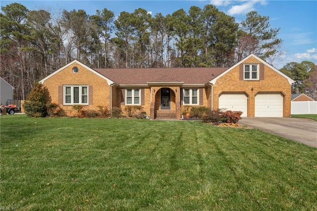 single story home with brick siding, driveway, a front yard, and fence