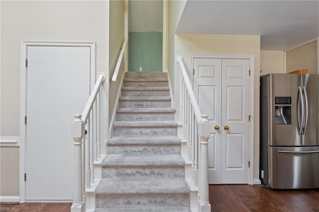 stairway featuring wood finished floors