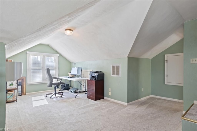 carpeted office space featuring vaulted ceiling, baseboards, and visible vents