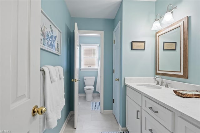 bathroom with tile patterned floors, baseboards, toilet, and vanity