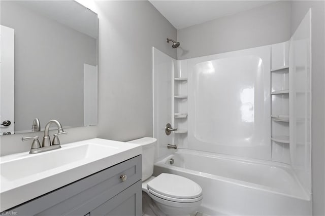 bathroom with vanity, shower / bathing tub combination, and toilet