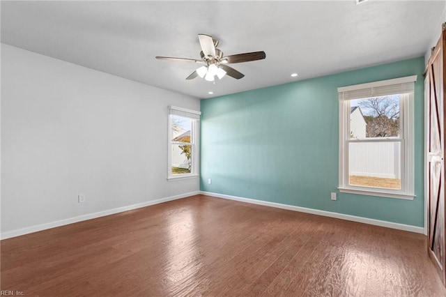 spare room featuring recessed lighting, wood finished floors, baseboards, and ceiling fan