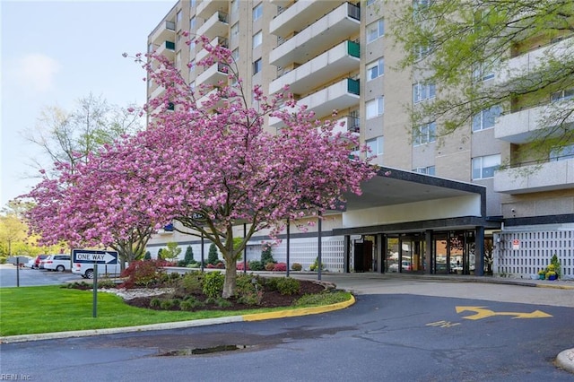 view of property featuring a parking lot