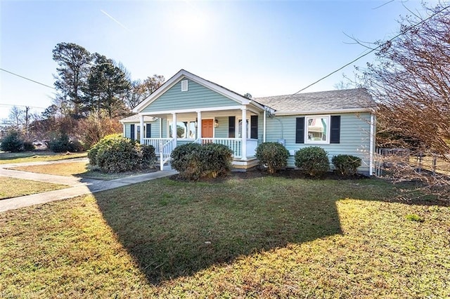 bungalow-style house with a porch and a front lawn