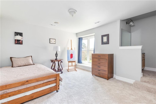 bedroom with visible vents, baseboards, and carpet flooring