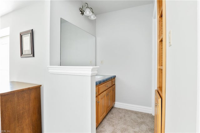 bathroom featuring vanity and baseboards