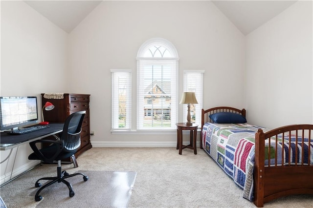 bedroom with baseboards, carpet floors, and vaulted ceiling