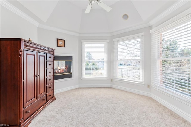 interior space with light colored carpet, baseboards, and vaulted ceiling