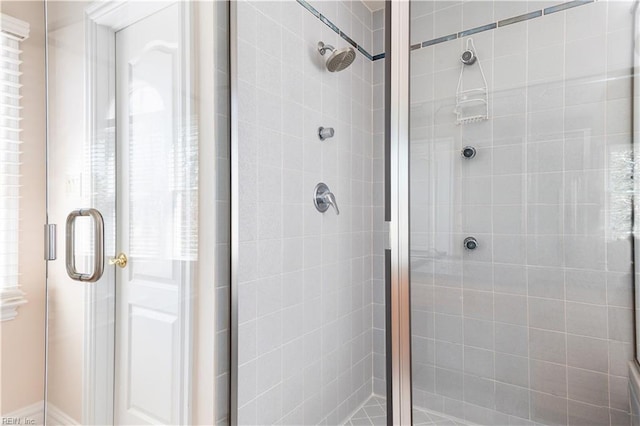 bathroom featuring a shower stall