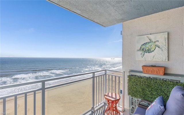 balcony with a view of the beach and a water view