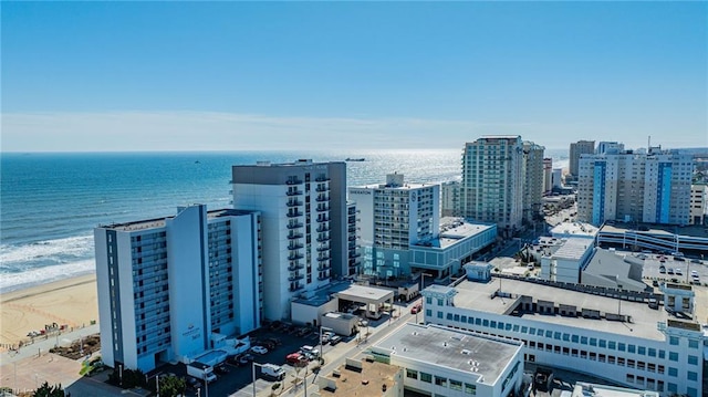 birds eye view of property with a city view and a water view