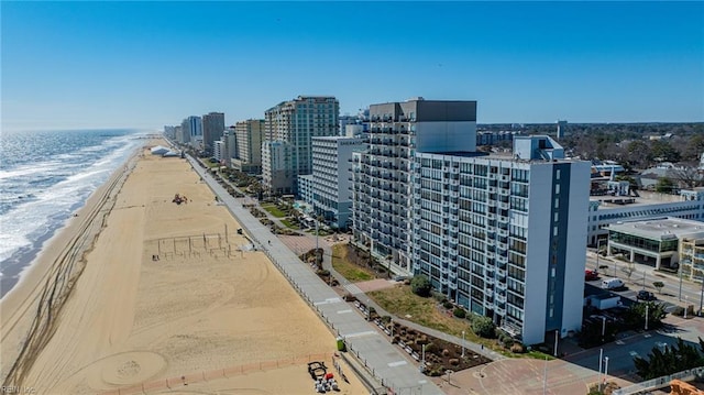 bird's eye view with a city view, a view of the beach, and a water view