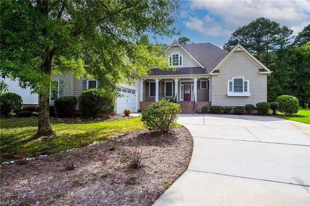 craftsman-style house with a garage, a front yard, roof with shingles, and driveway