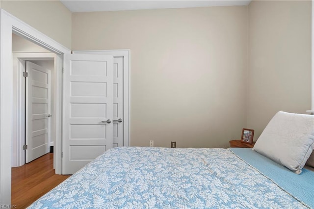 bedroom with wood finished floors