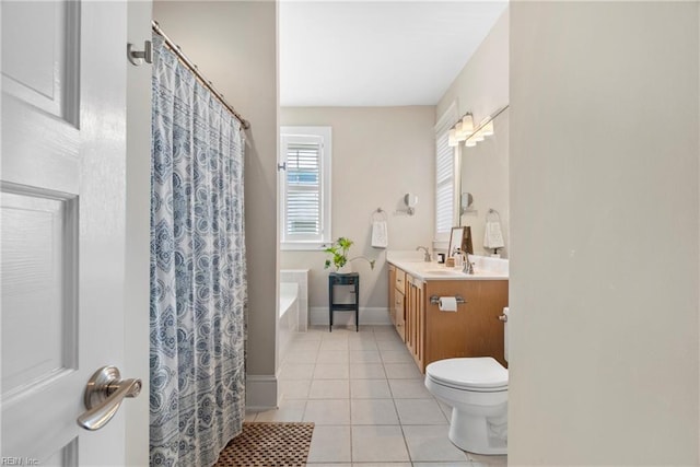 full bath featuring vanity, baseboards, a tub, tile patterned floors, and toilet