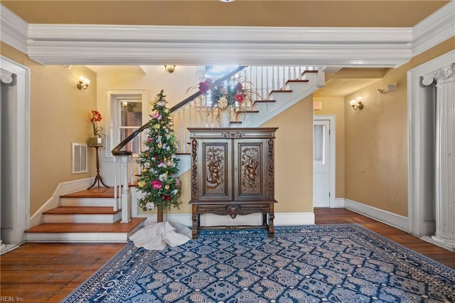 interior space featuring visible vents, ornamental molding, and stairs