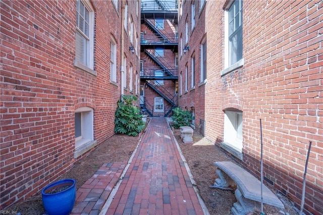 view of side of home with brick siding