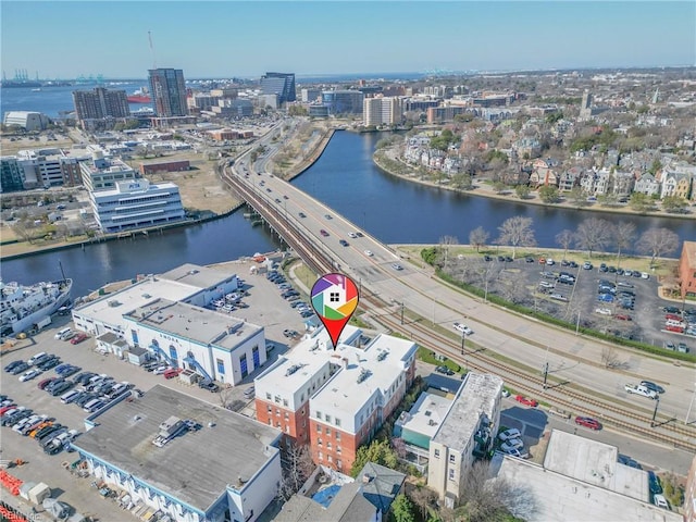 drone / aerial view featuring a view of city and a water view