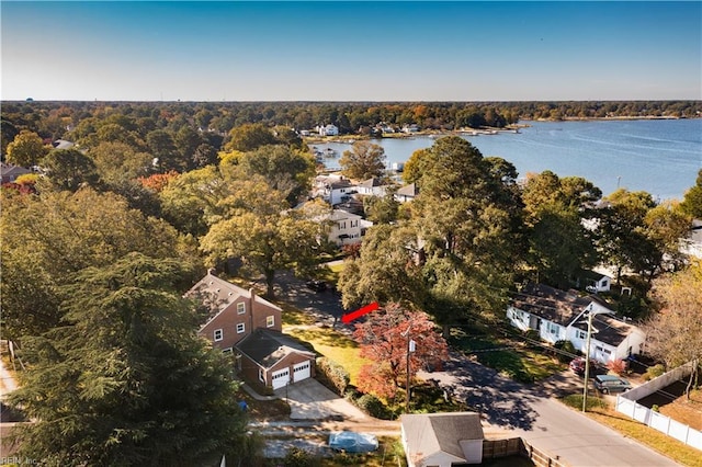 bird's eye view featuring a forest view and a water view