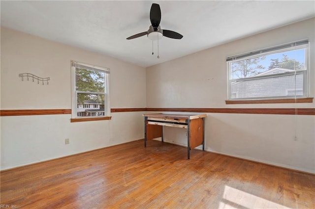 spare room featuring a ceiling fan and hardwood / wood-style flooring