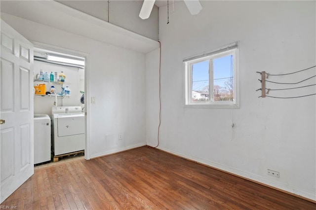 washroom with baseboards, washer and clothes dryer, laundry area, light wood-style floors, and a ceiling fan