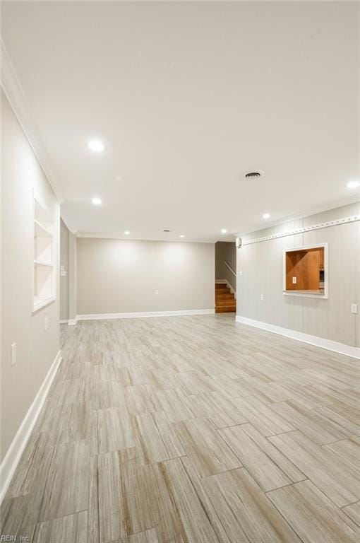 below grade area with recessed lighting, stairway, baseboards, and built in features