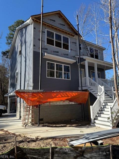 view of front of house featuring a porch and stairs