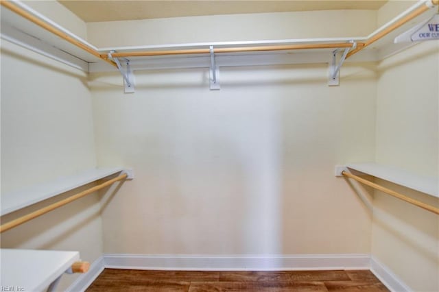 spacious closet with wood finished floors