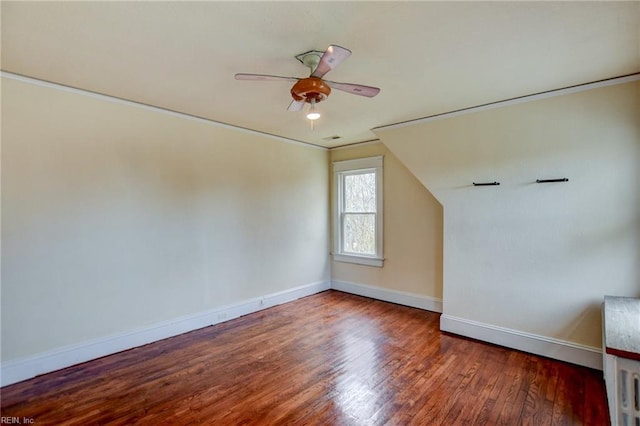 additional living space featuring ceiling fan, baseboards, and wood finished floors